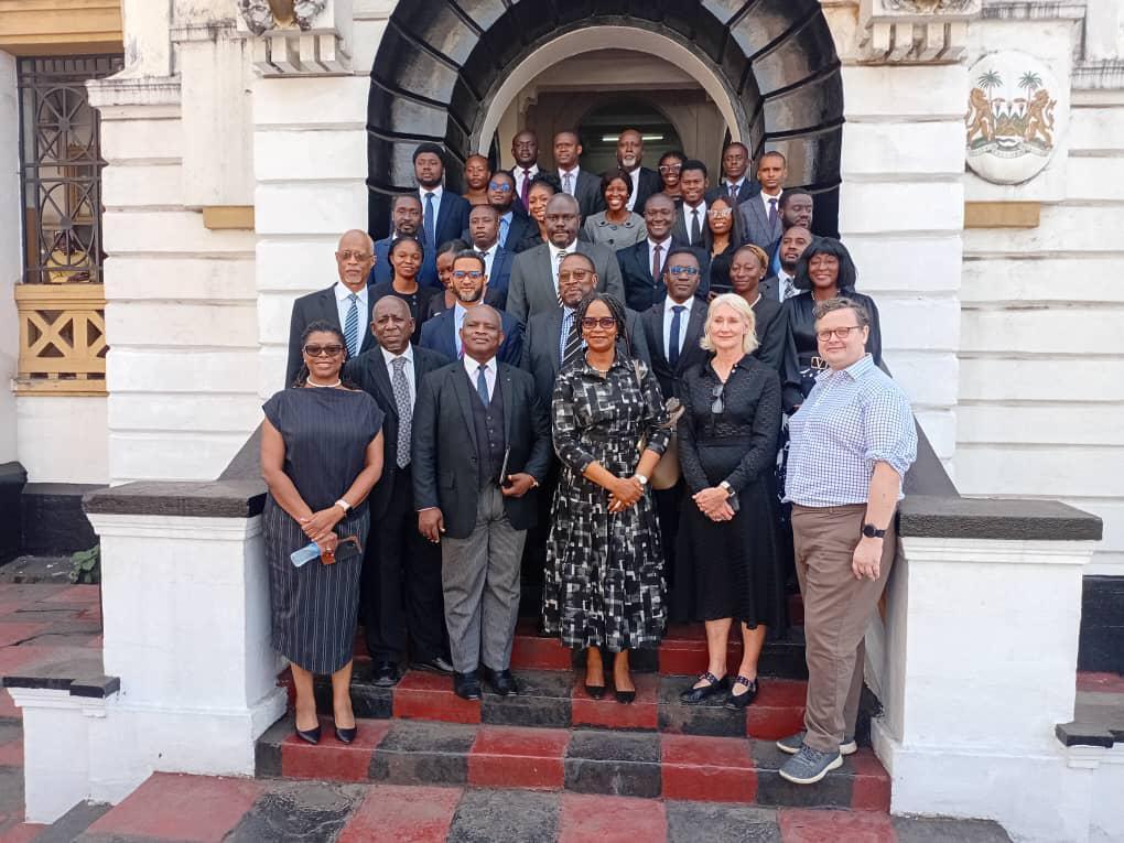 Sierra Legal Advocates advocates and clients on the steps of the High Court in Freetown